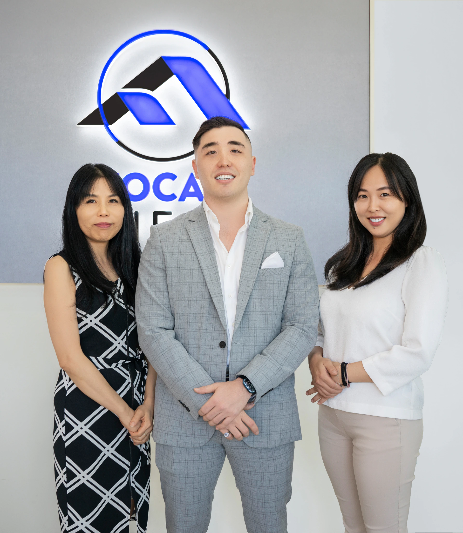 Jade Soong, Philip Paznikov and Serena Wang at the Focal Real Estate office